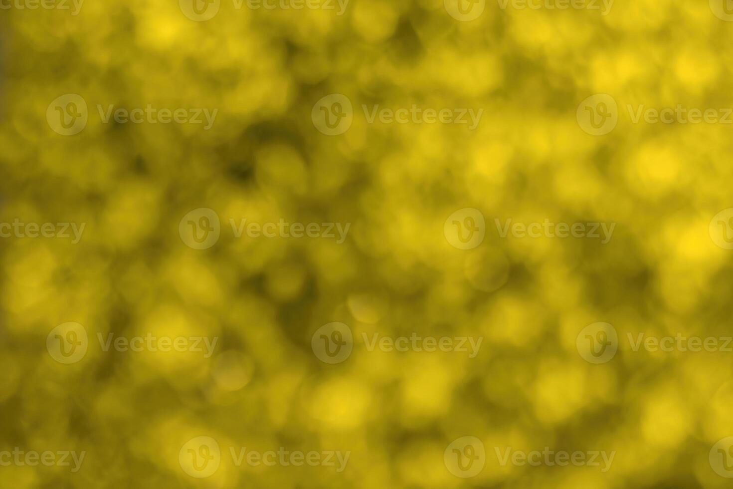 Blurred bokeh background image of bright yellow foliage in golden autumn. photo