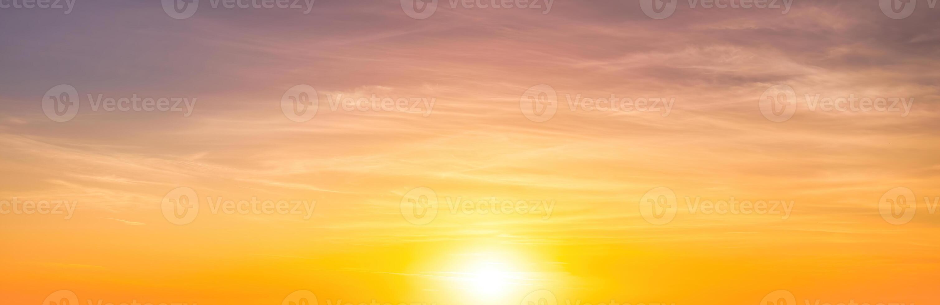 Colorful dramatic clouds lit by a sun against the sunset or sunrise sky. photo