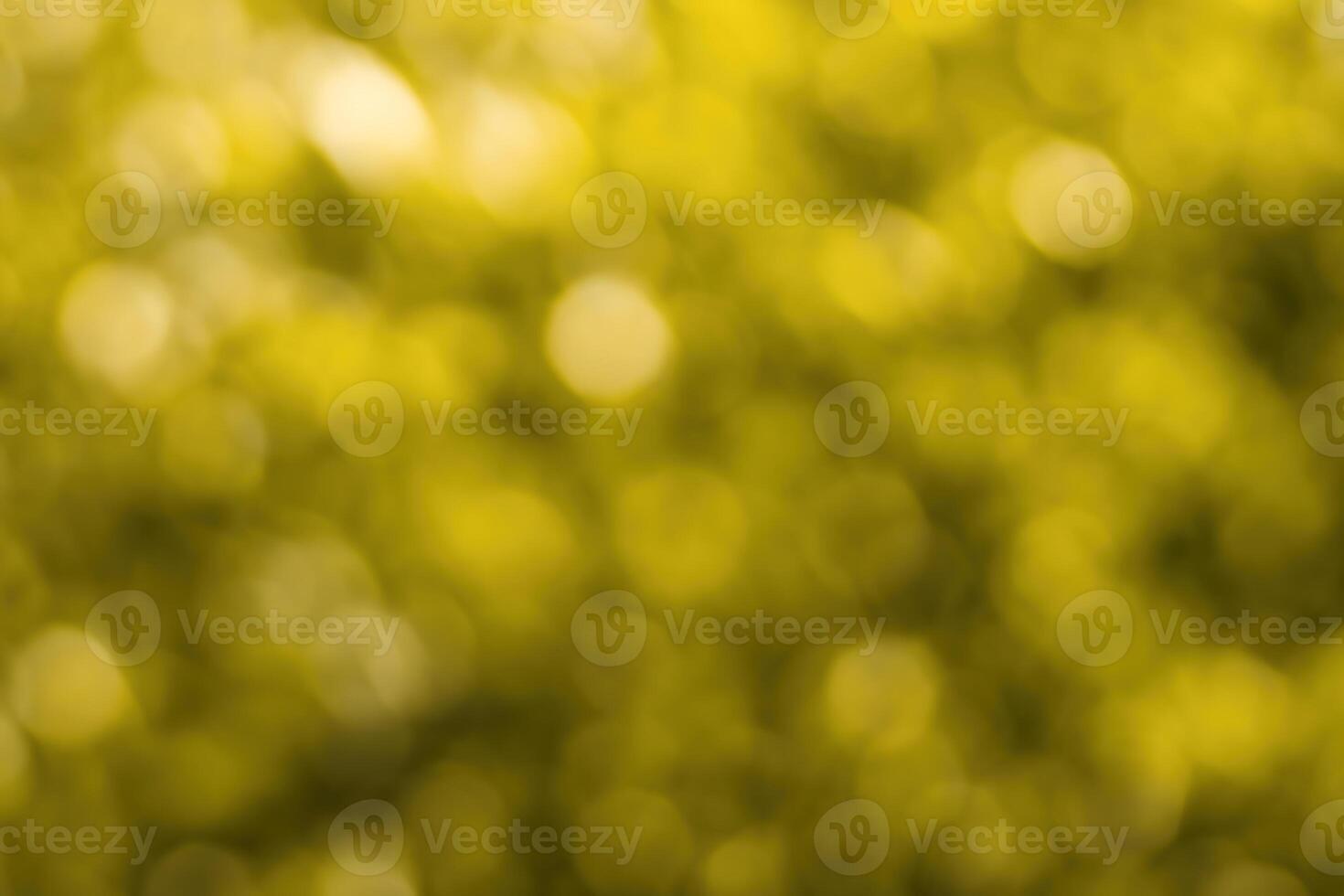 Blurred bokeh background image of bright yellow foliage in golden autumn. photo