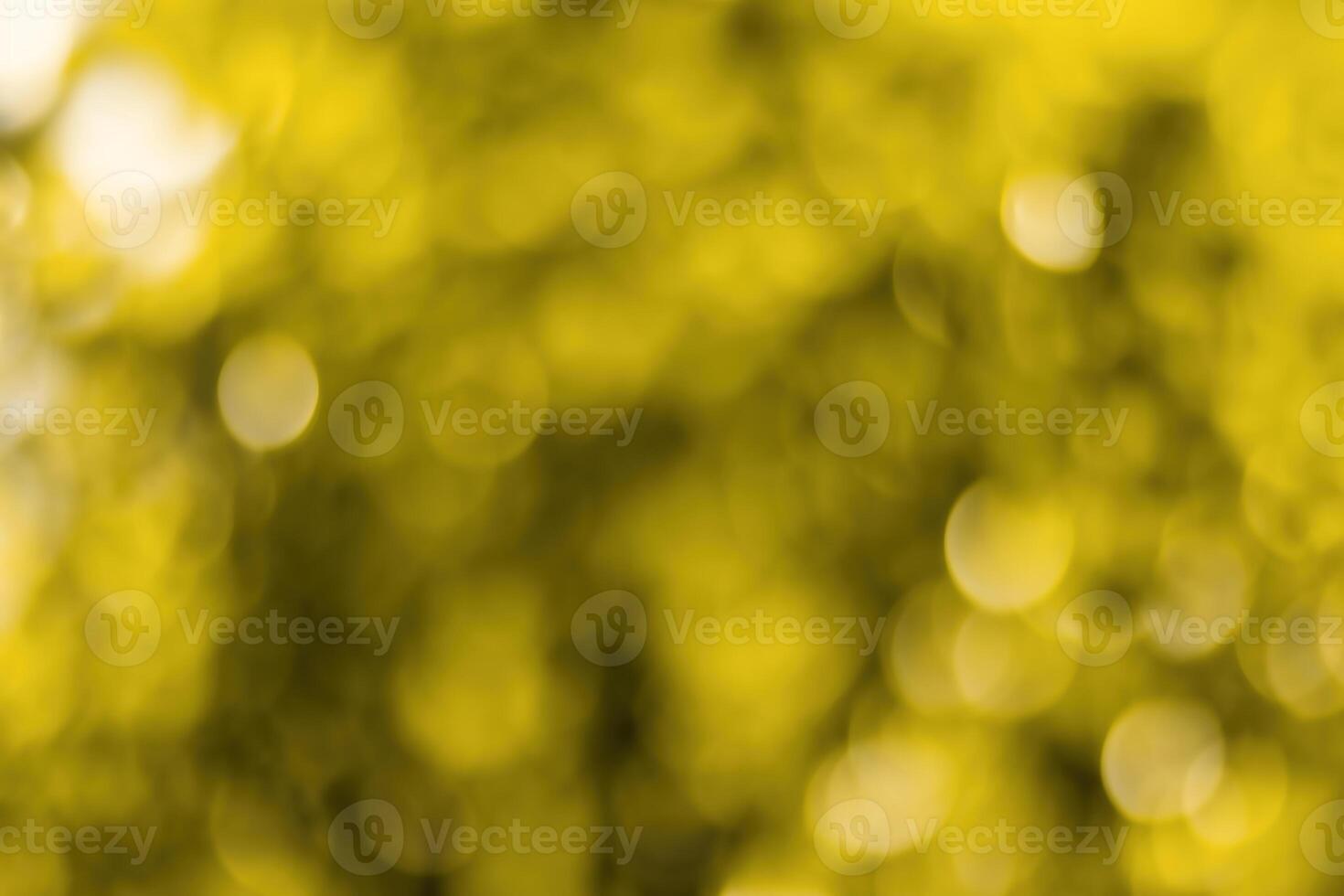 Blurred bokeh background image of bright yellow foliage in golden autumn. photo
