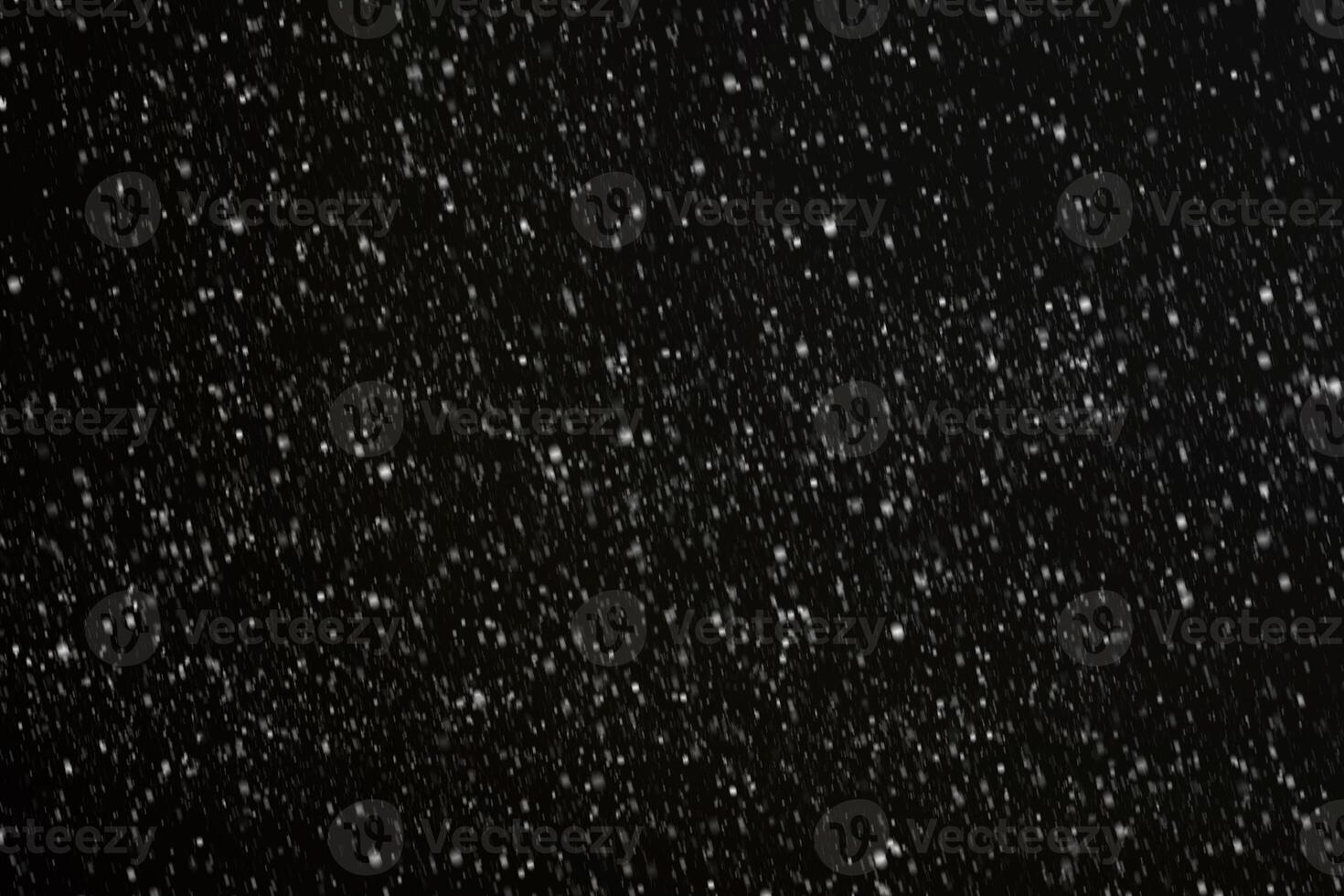 White snow on a black background texture. photo