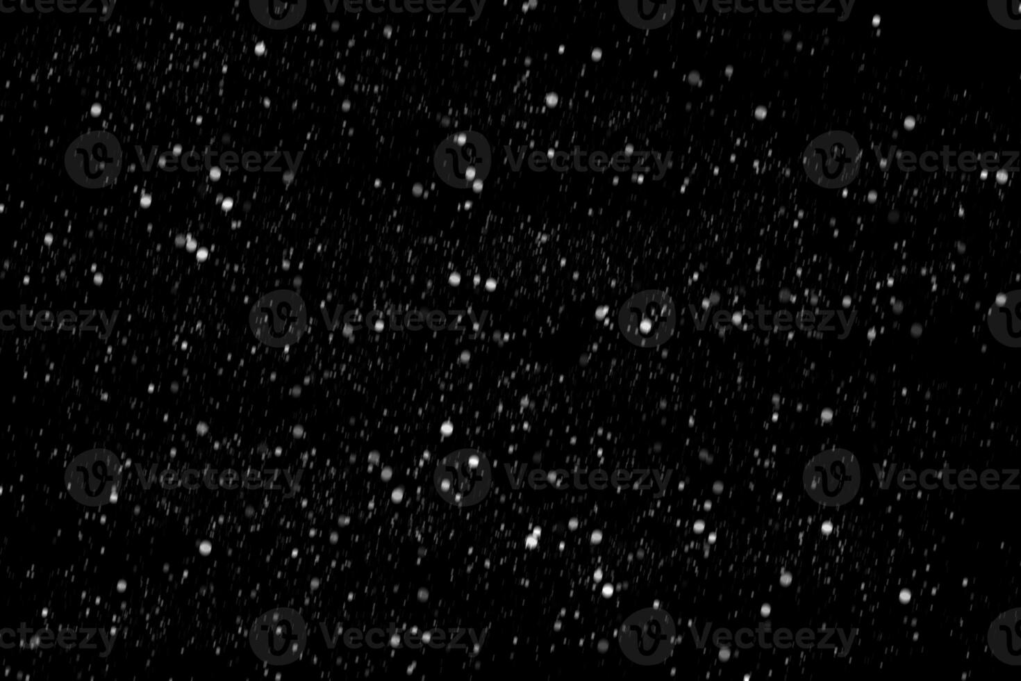 White snow on a black background texture. photo
