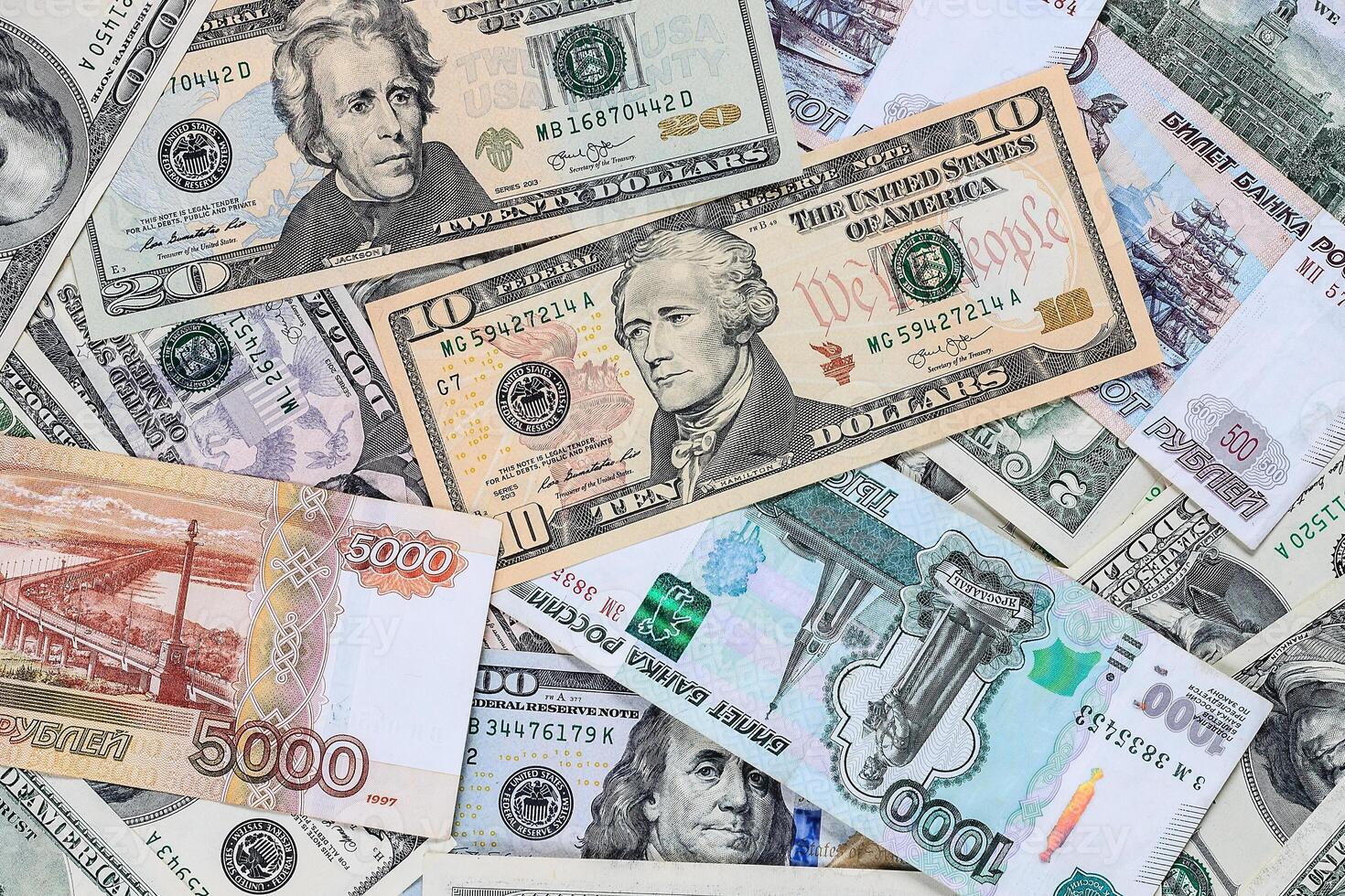 Background with money american dollar, ruble and euros bills. photo