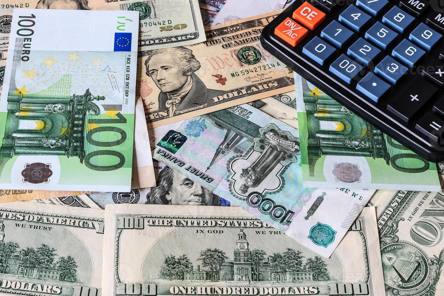 Dollar and ruble bils and black calculator. photo
