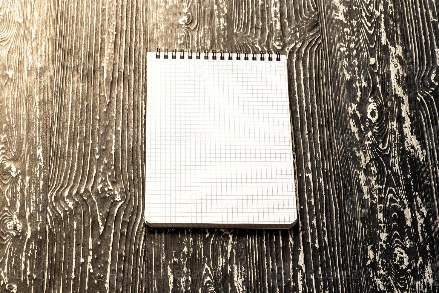 The notebook on a black table with a copy space. Template for mock up and presentation design. photo
