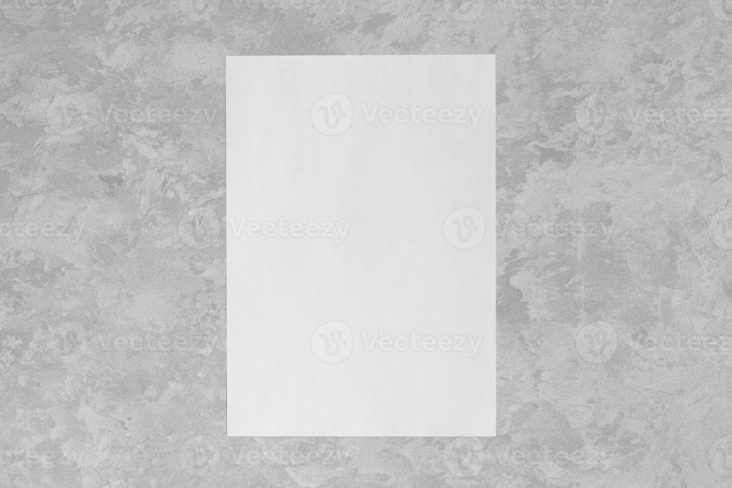 White paper on a gray decorative plaster. Abstract background for design photo