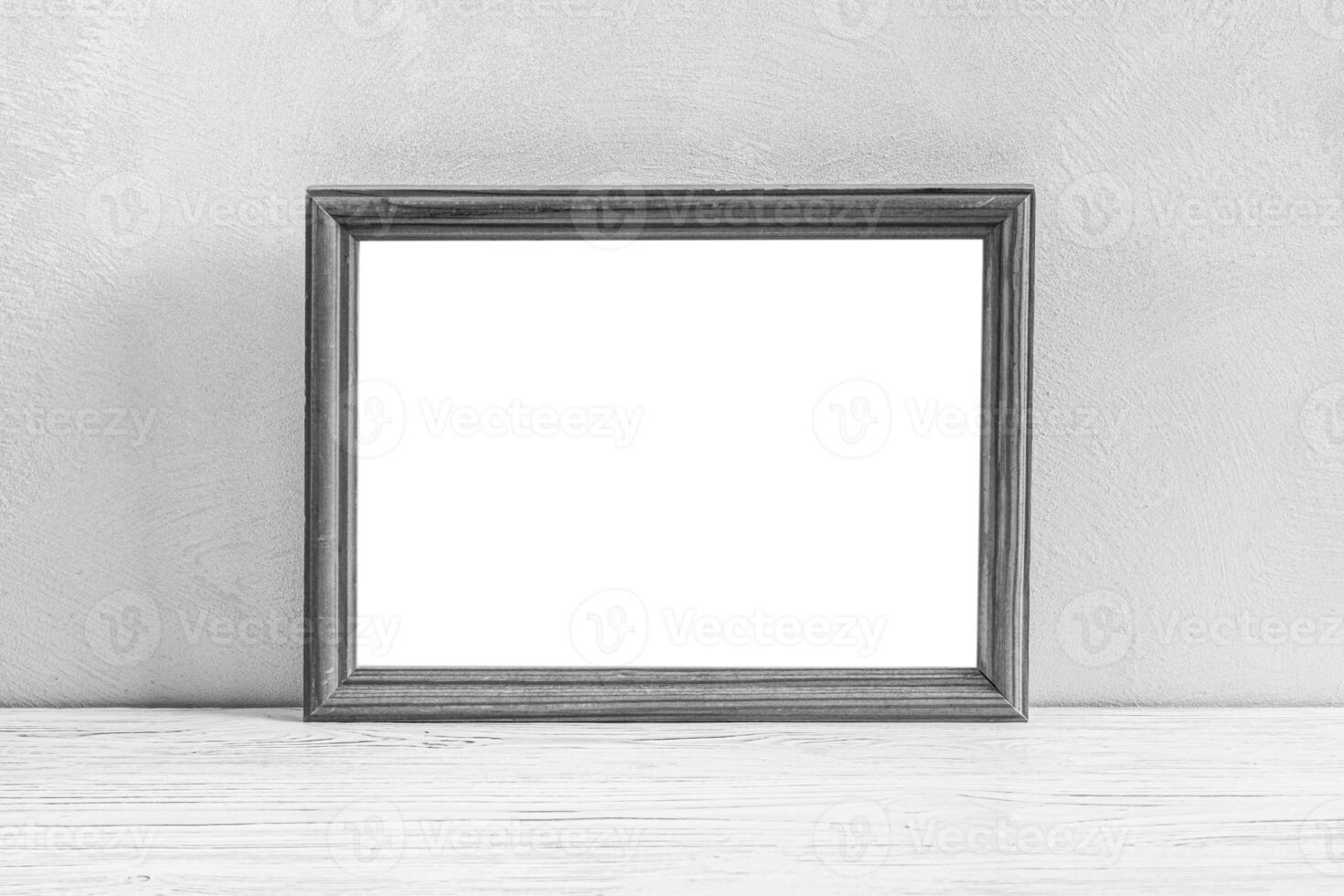 Wooden floor over concrete or decorative plaster wall and photo frame with copy space for a text background.