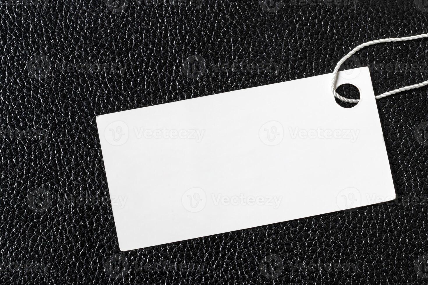 White label on a black leather. Abstract background for design. photo