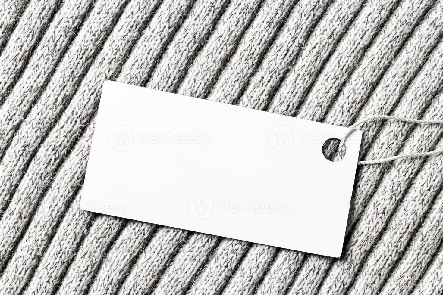 White label on a woolen fabric. Abstract background for design. Art stylized baner or mock up with copy space. photo