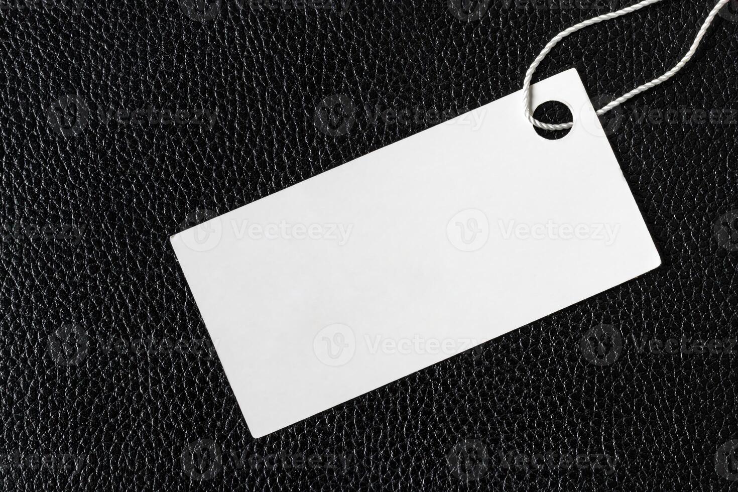 White label on a black leather. Abstract background for design. photo