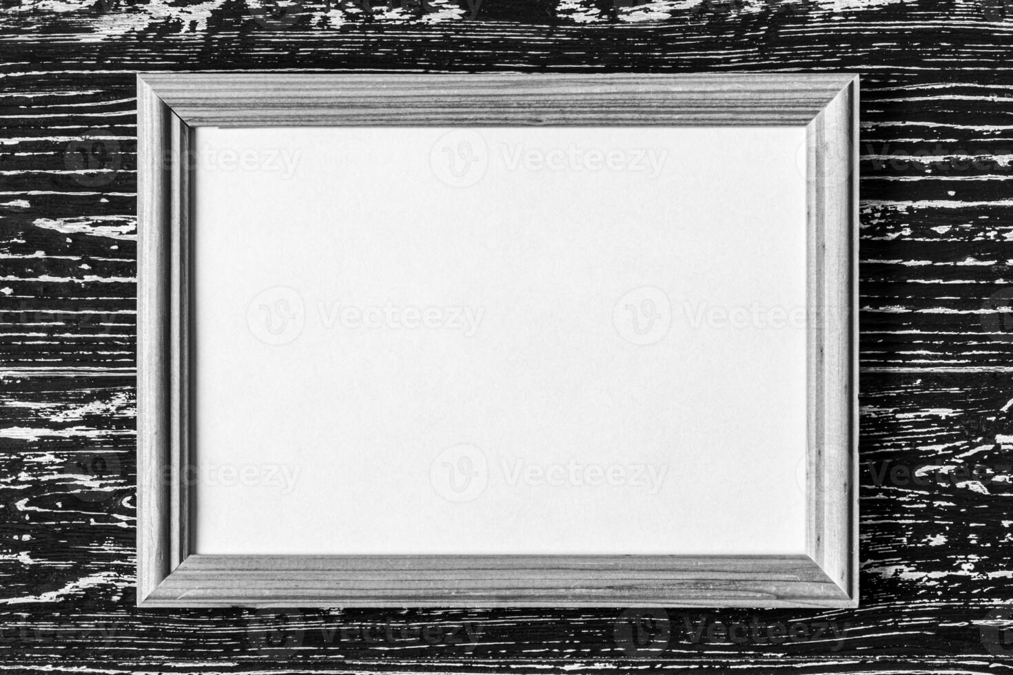 Photo frame on a wooden table. Abstract background for design.