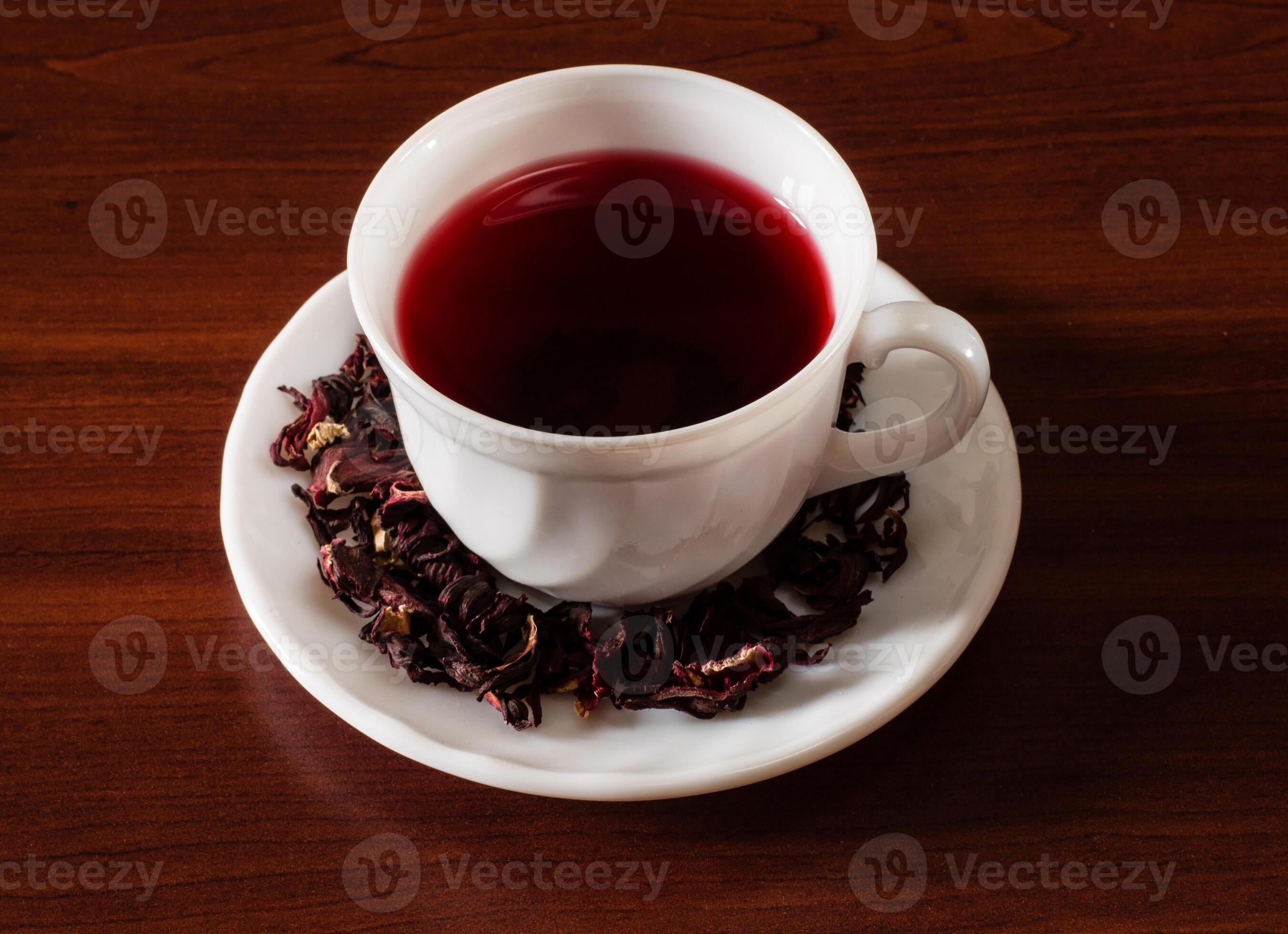 Cup of Karkadeh Red Tea with Dry Flowers on wooden table 46215942 Stock ...