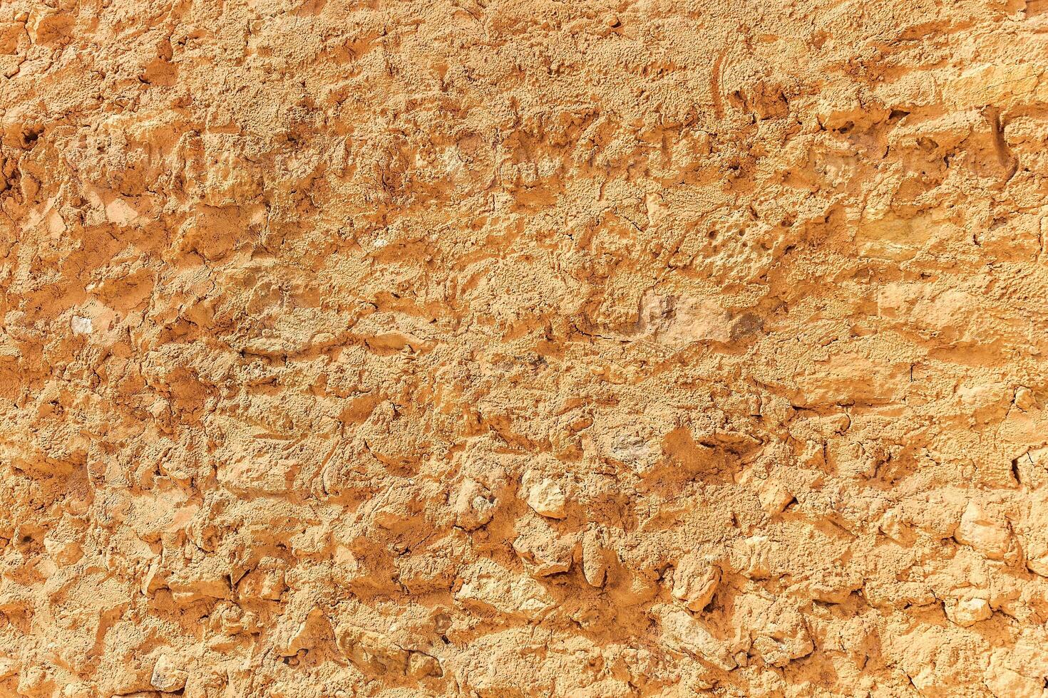 Background of ancient stone wall. Texture of old brick. photo