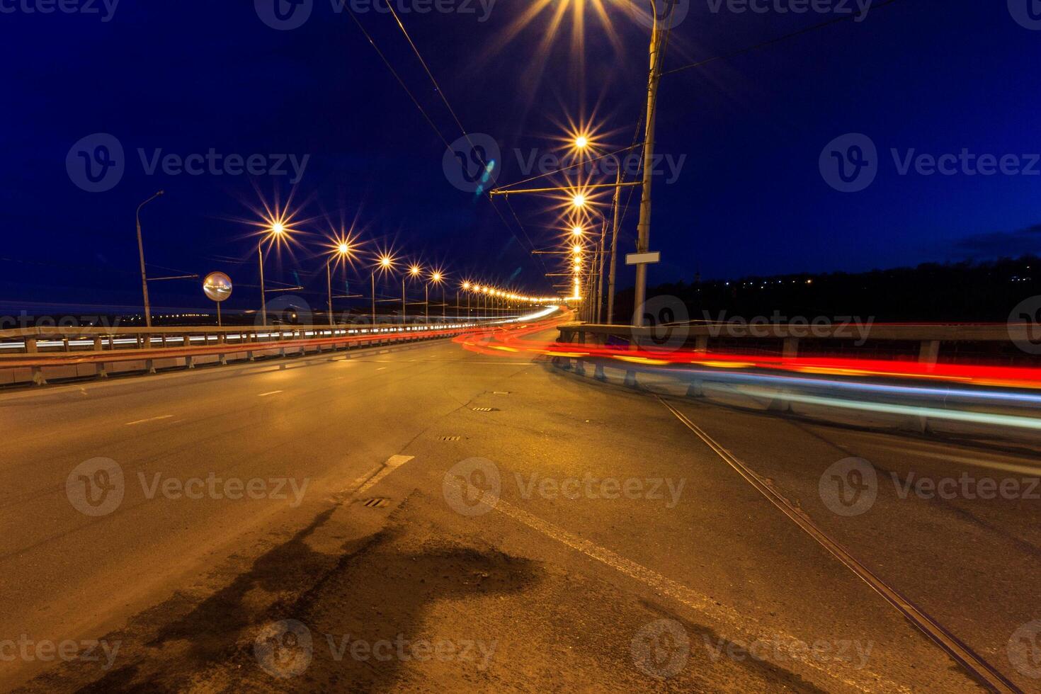 Moving car with blur light through twilight city. photo