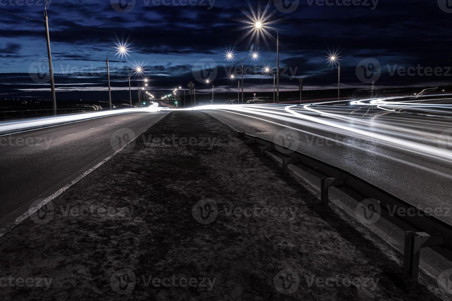 Moving car with blur light through twilight city. photo