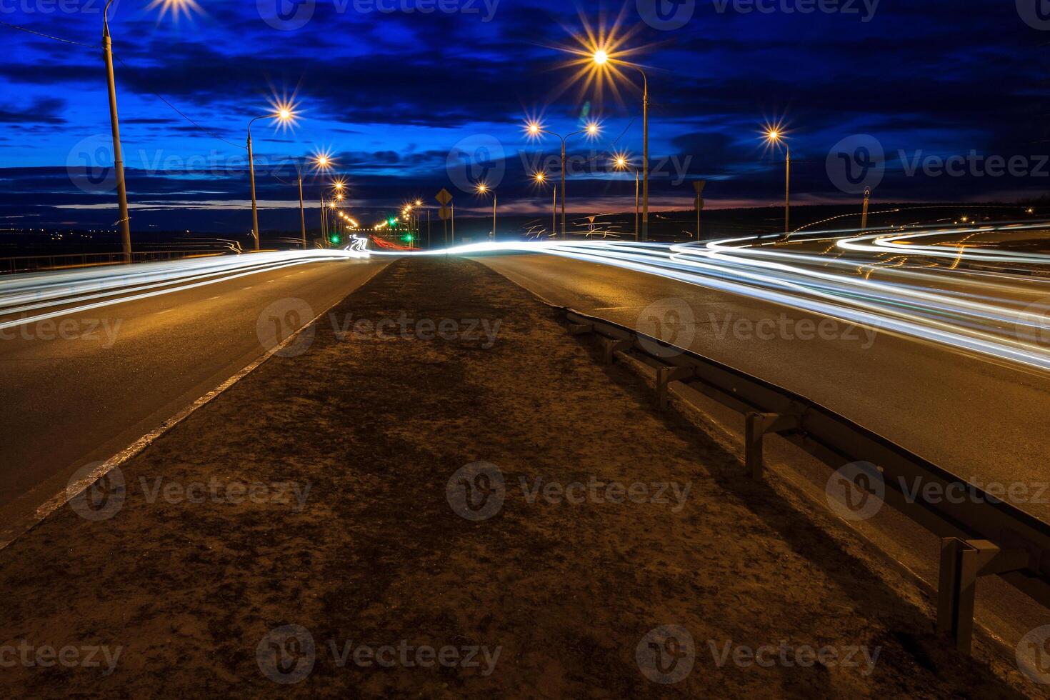Moving car with blur light through twilight city. photo