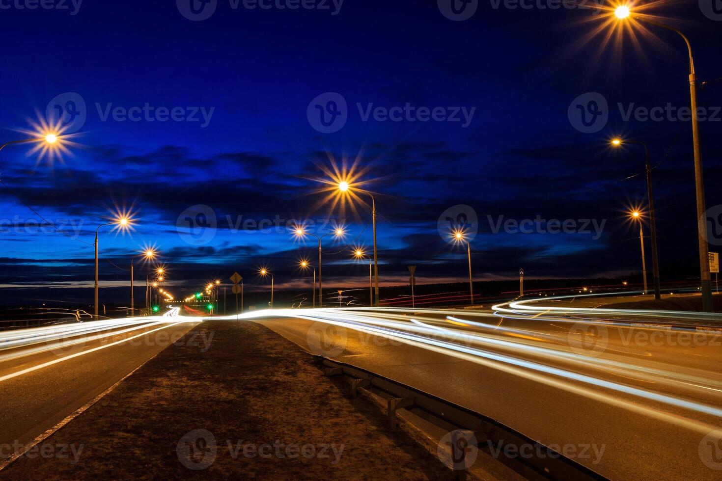 Moving car with blur light through twilight city. photo