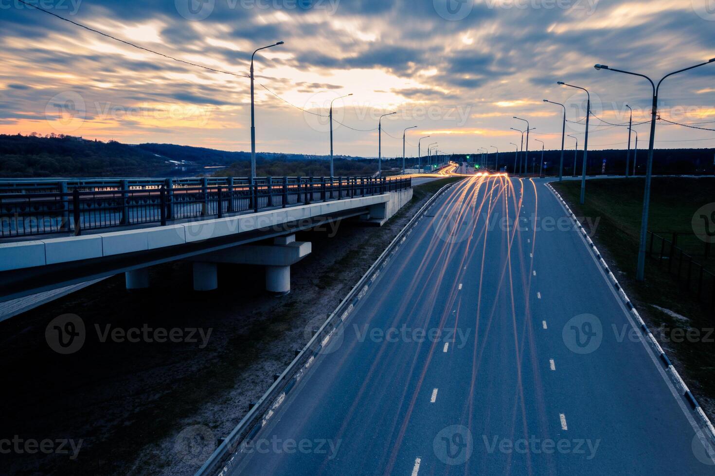 Moving car with blur light through twilight city. photo
