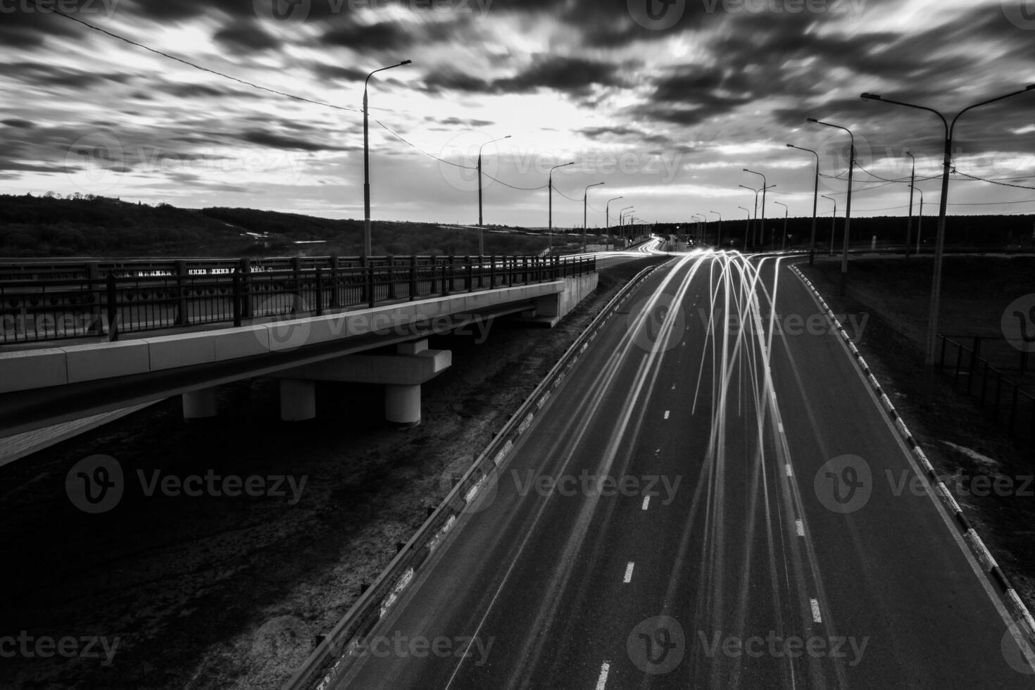 Moving car with blur light through twilight city. photo