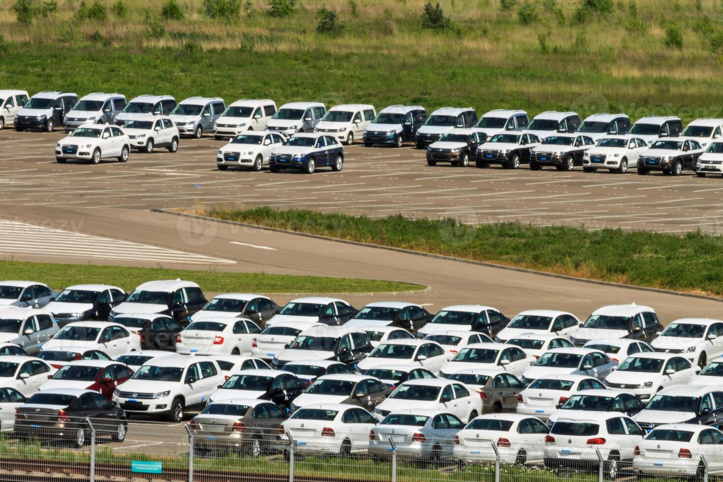 Volkswagen - JUNE 16, 2016 New cars parked at distribution center, auto factory photo