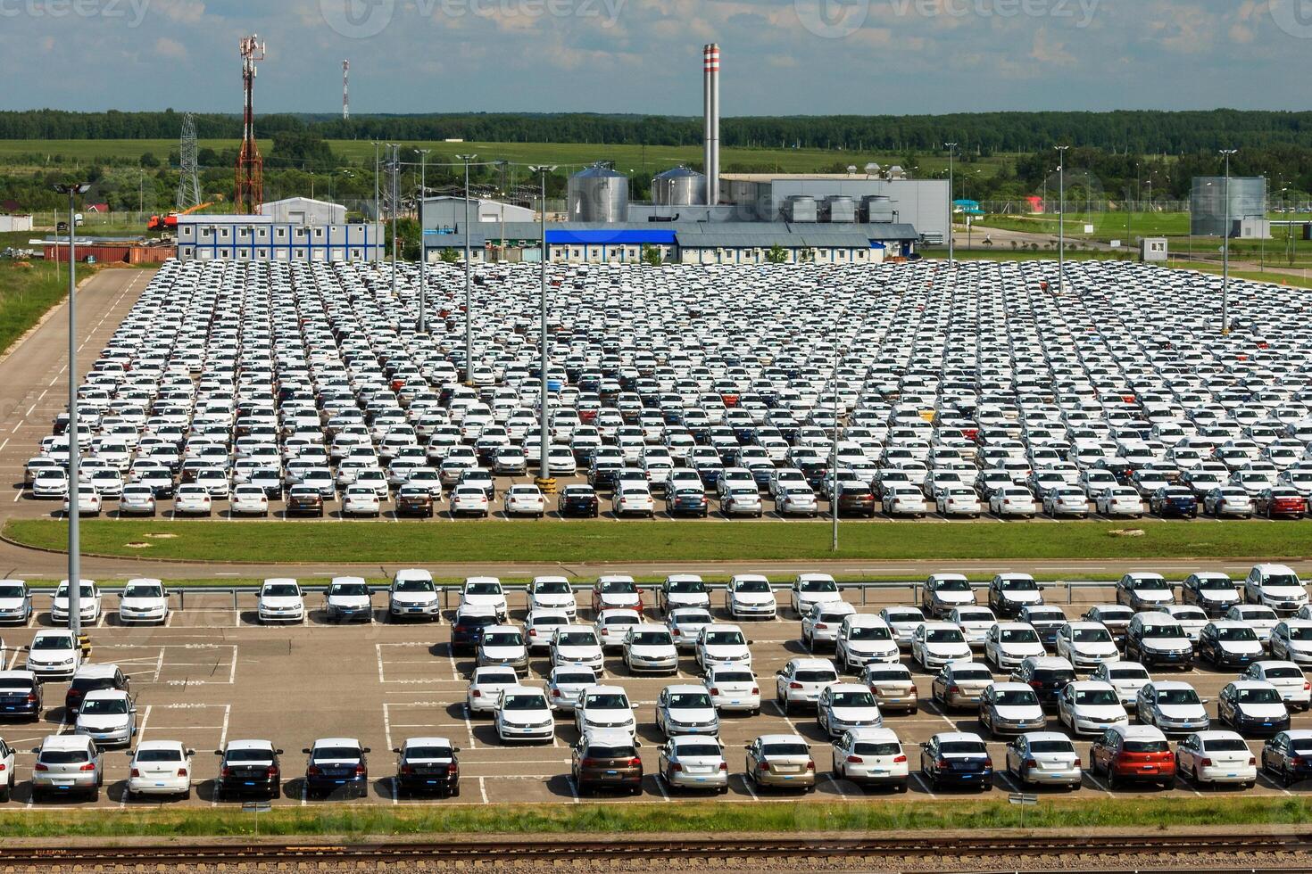 Volkswagen - JUNE 16, 2016 New cars parked at distribution center, auto factory photo