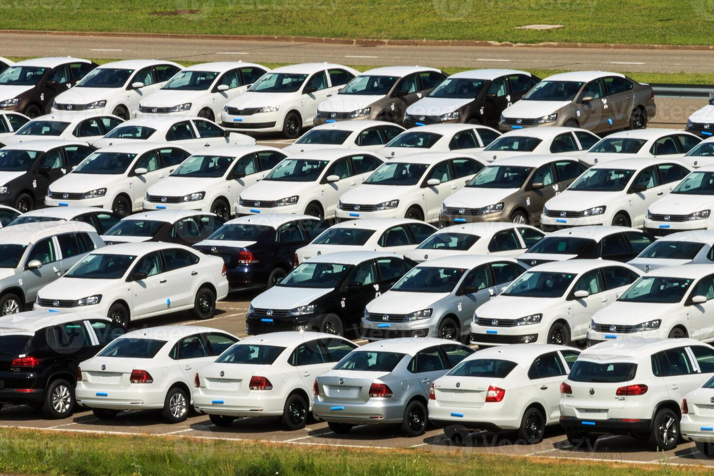 Volkswagen - JUNE 16, 2016 New cars parked at distribution center, auto factory photo
