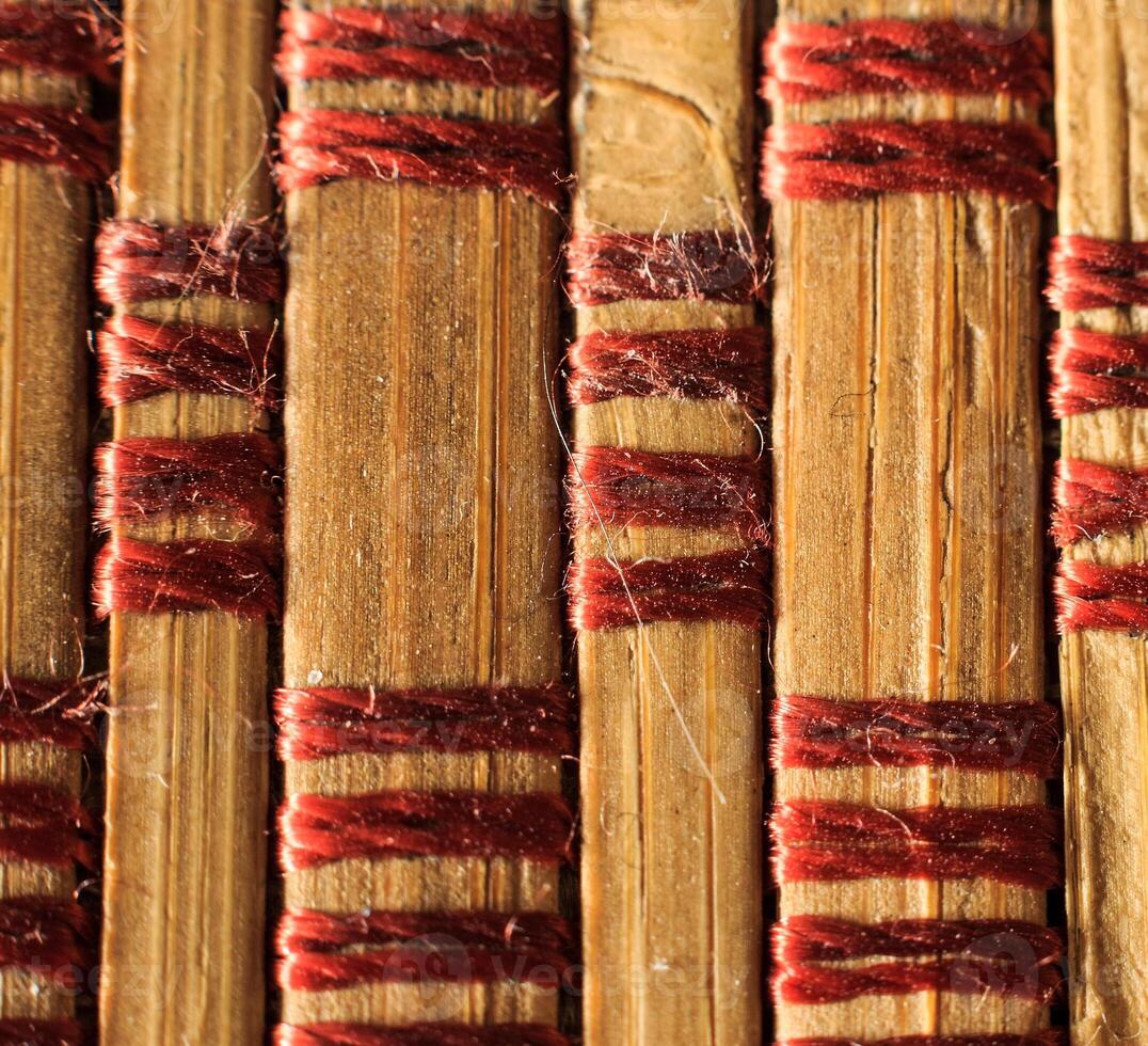 Texture of old bamboo branches with threads. photo