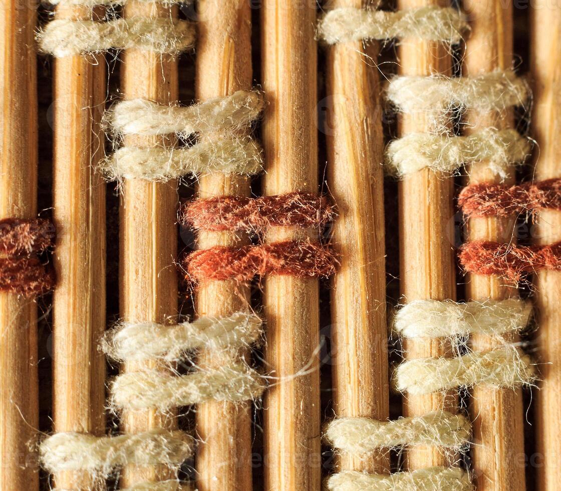 Texture of old bamboo branches with threads. photo