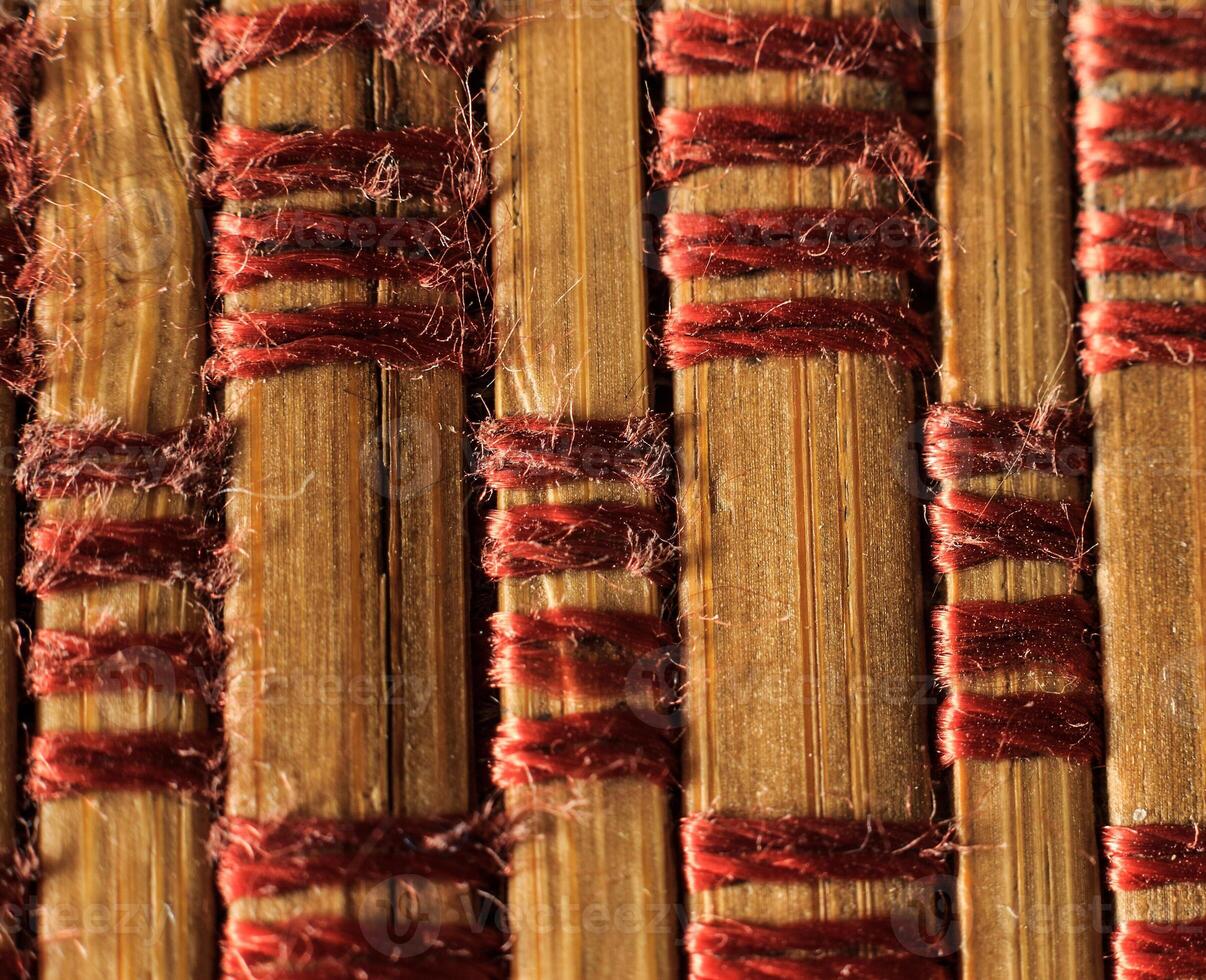Texture of old bamboo branches with threads. photo