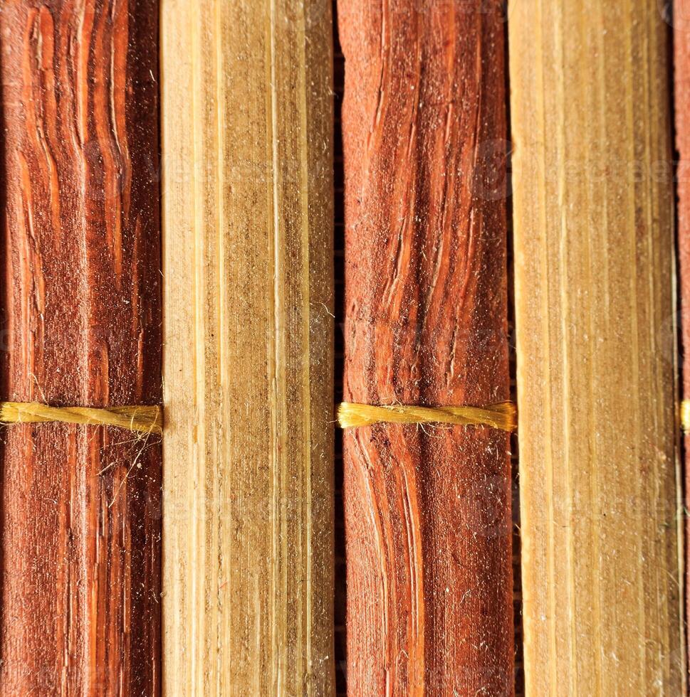Texture of old bamboo branches with threads. photo