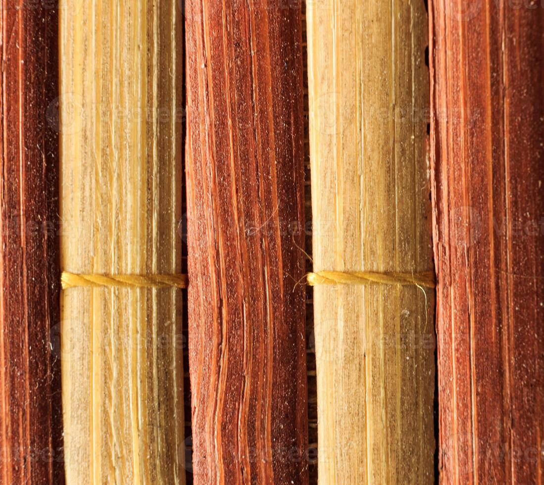 Texture of old bamboo branches with threads. photo