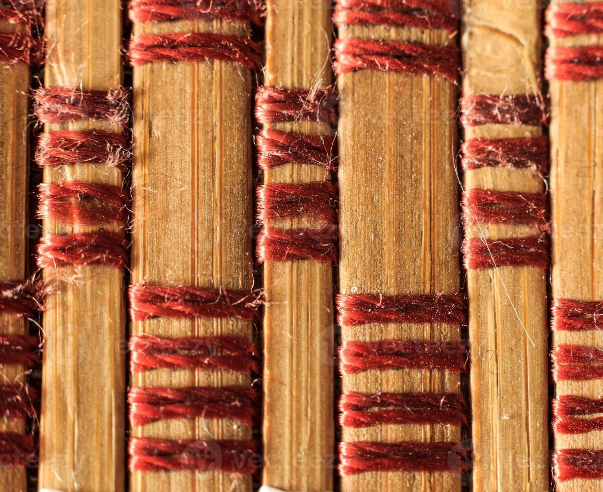 Texture of old bamboo branches with threads. photo