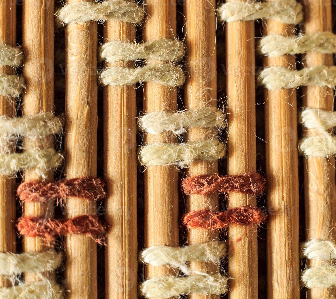 Texture of old bamboo branches with threads. photo