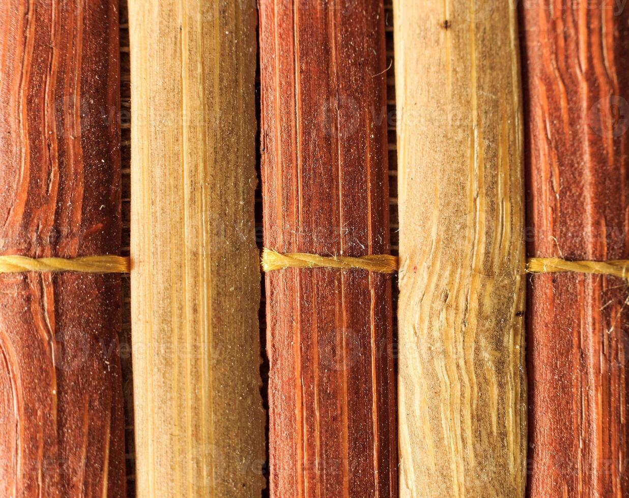 Texture of old bamboo branches with threads. photo