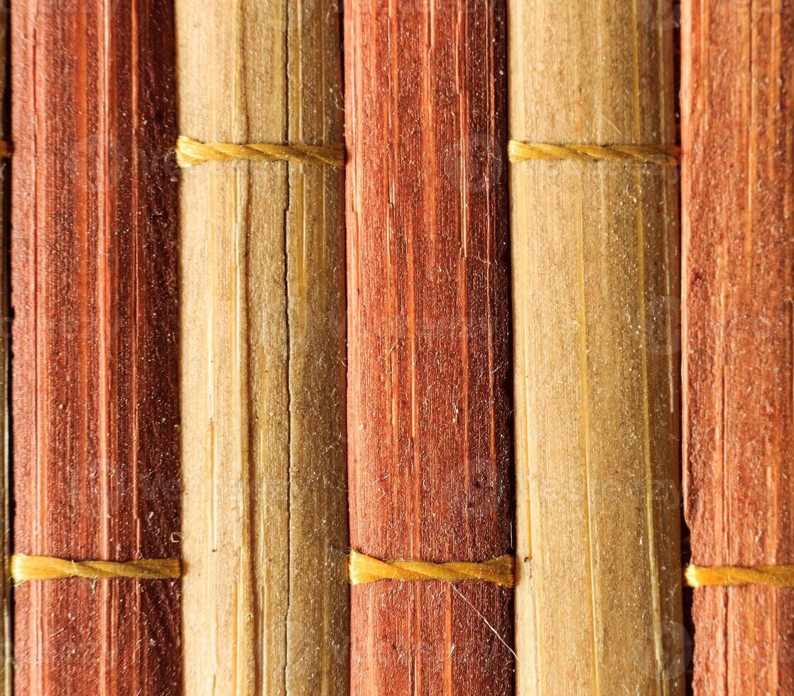 Texture of old bamboo branches with threads. photo