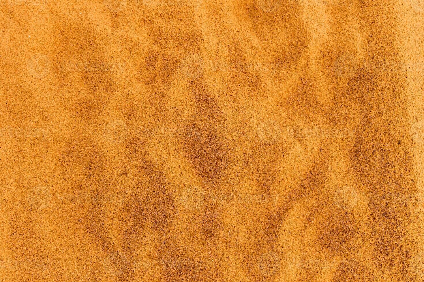 Sandy beach. Detailed sand texture photo