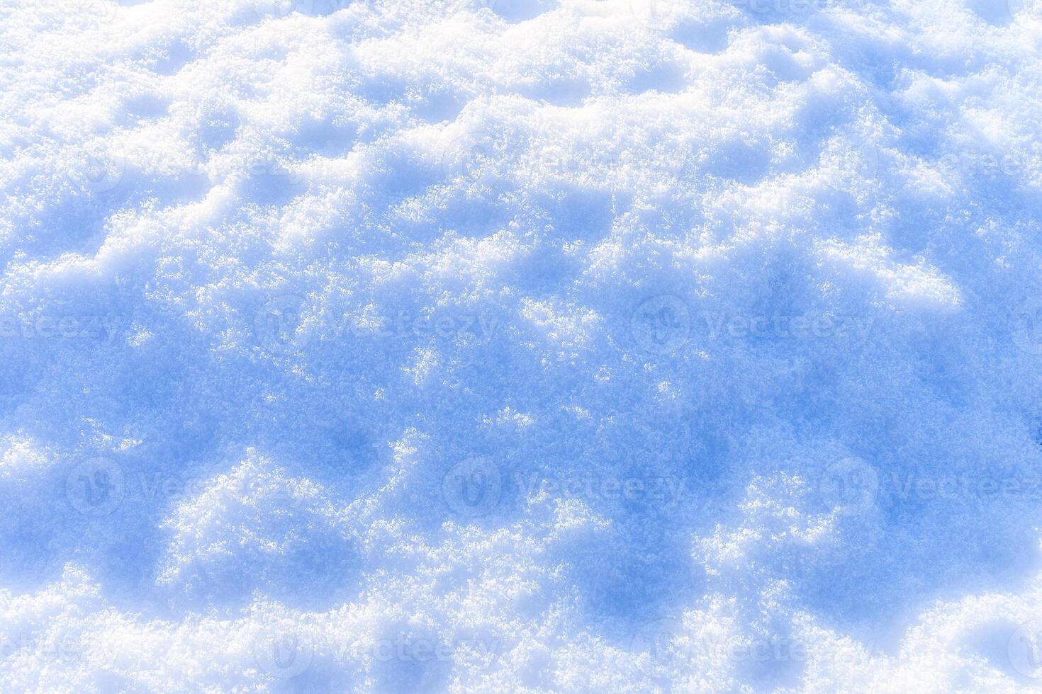 Snow texture at sunny winter day. Abstract background. photo