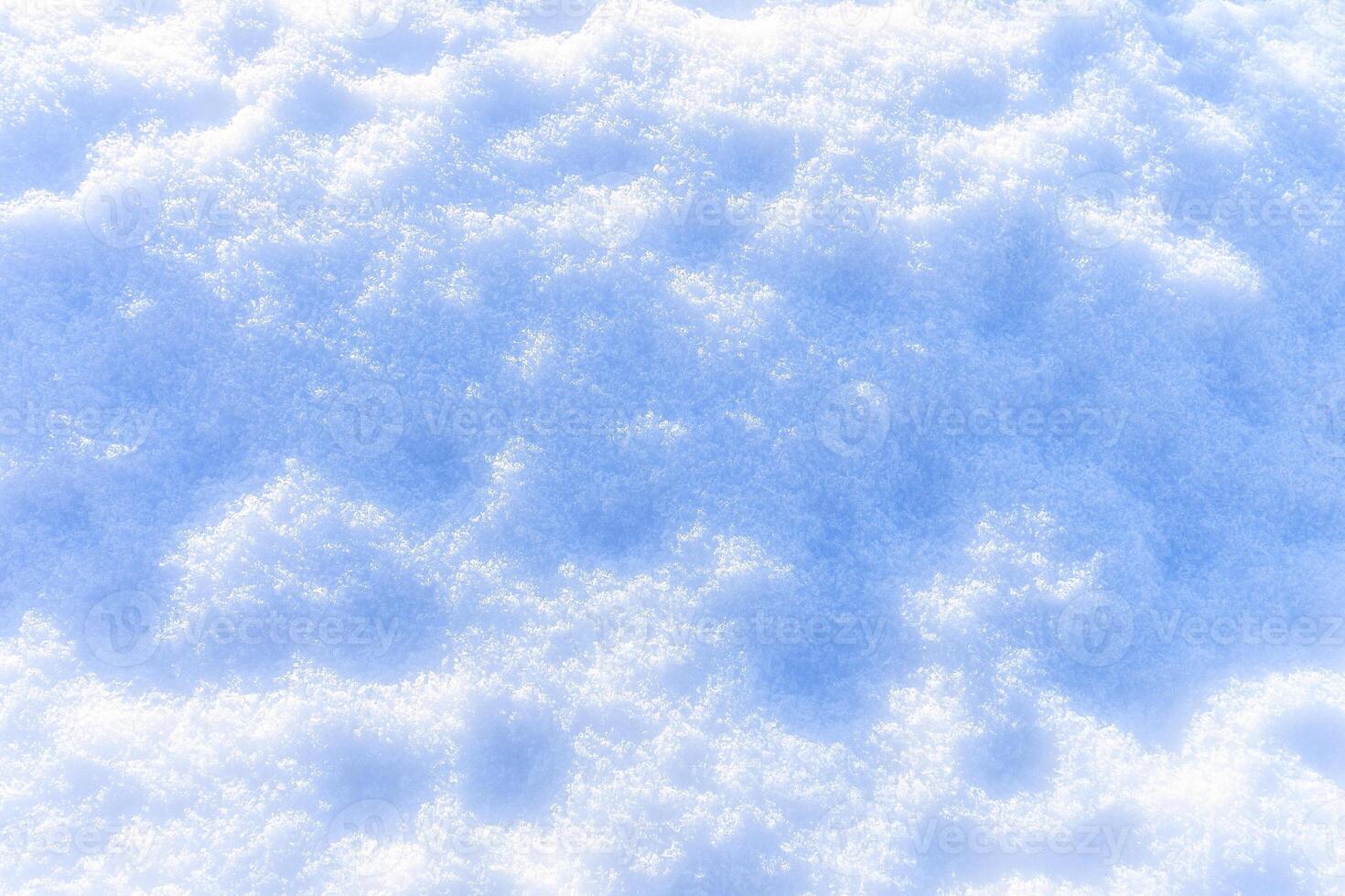Snow texture at sunny winter day. Abstract background. photo