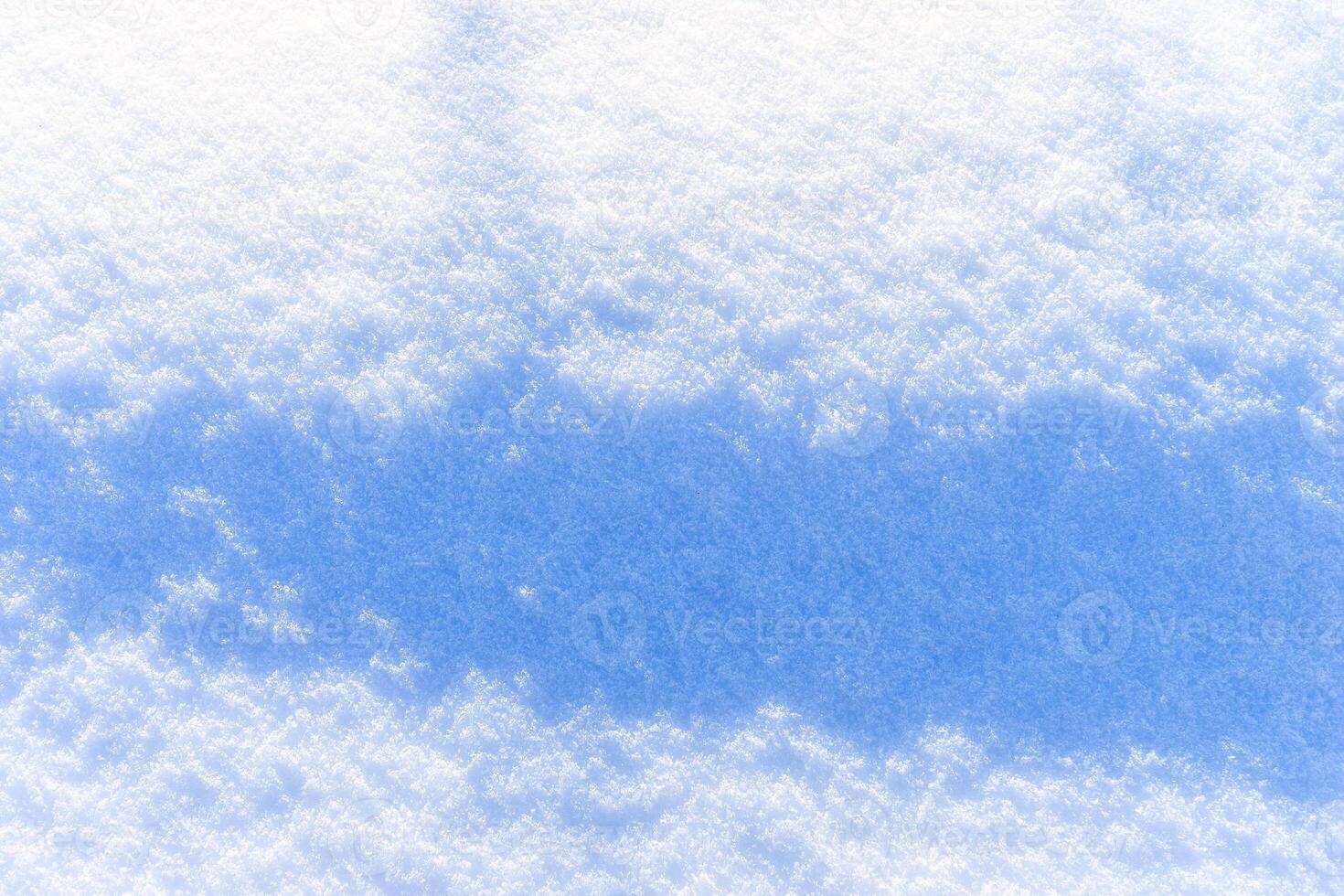 Snow texture at sunny winter day. Abstract background. photo