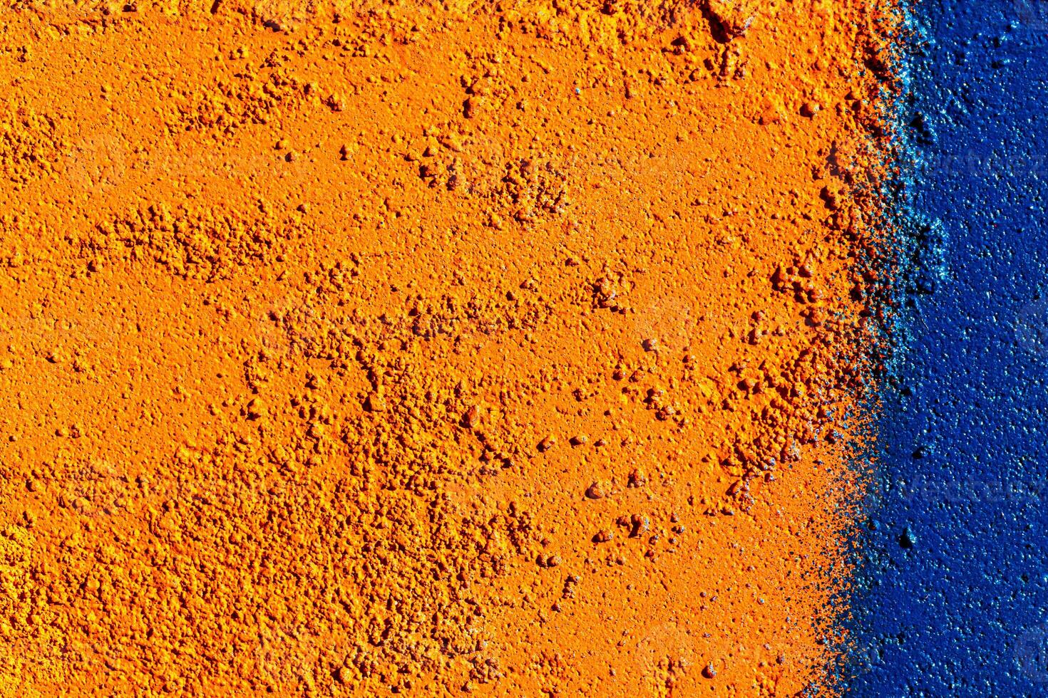 Fragment of colored graffiti painted on a wall. Abstract background for design. photo