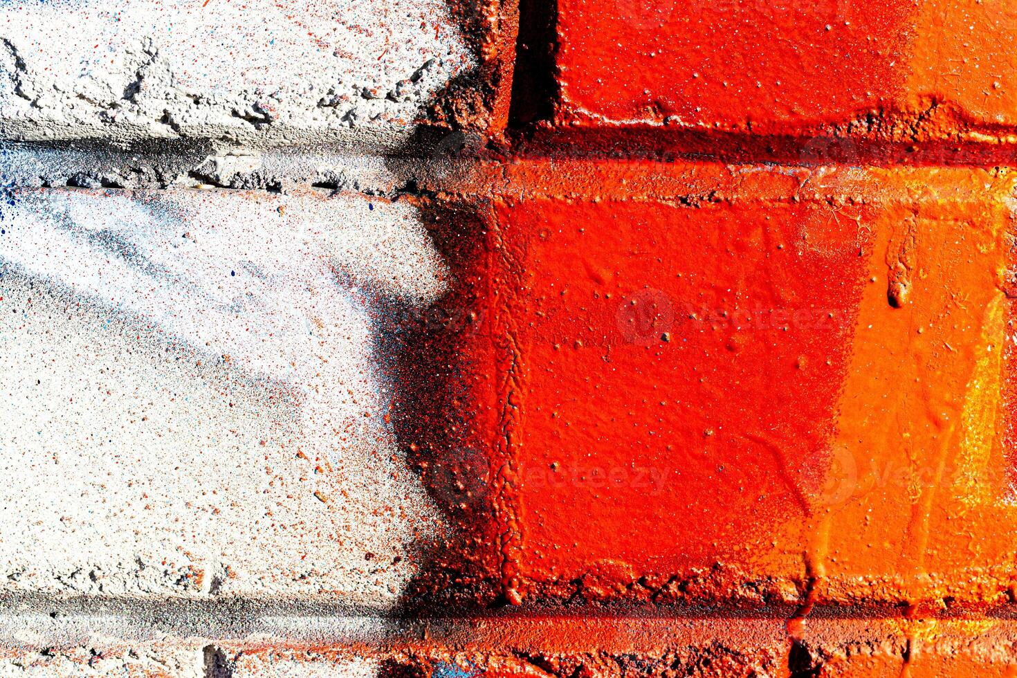 Fragment of colored graffiti painted on a brick wall. Abstract background for design. photo