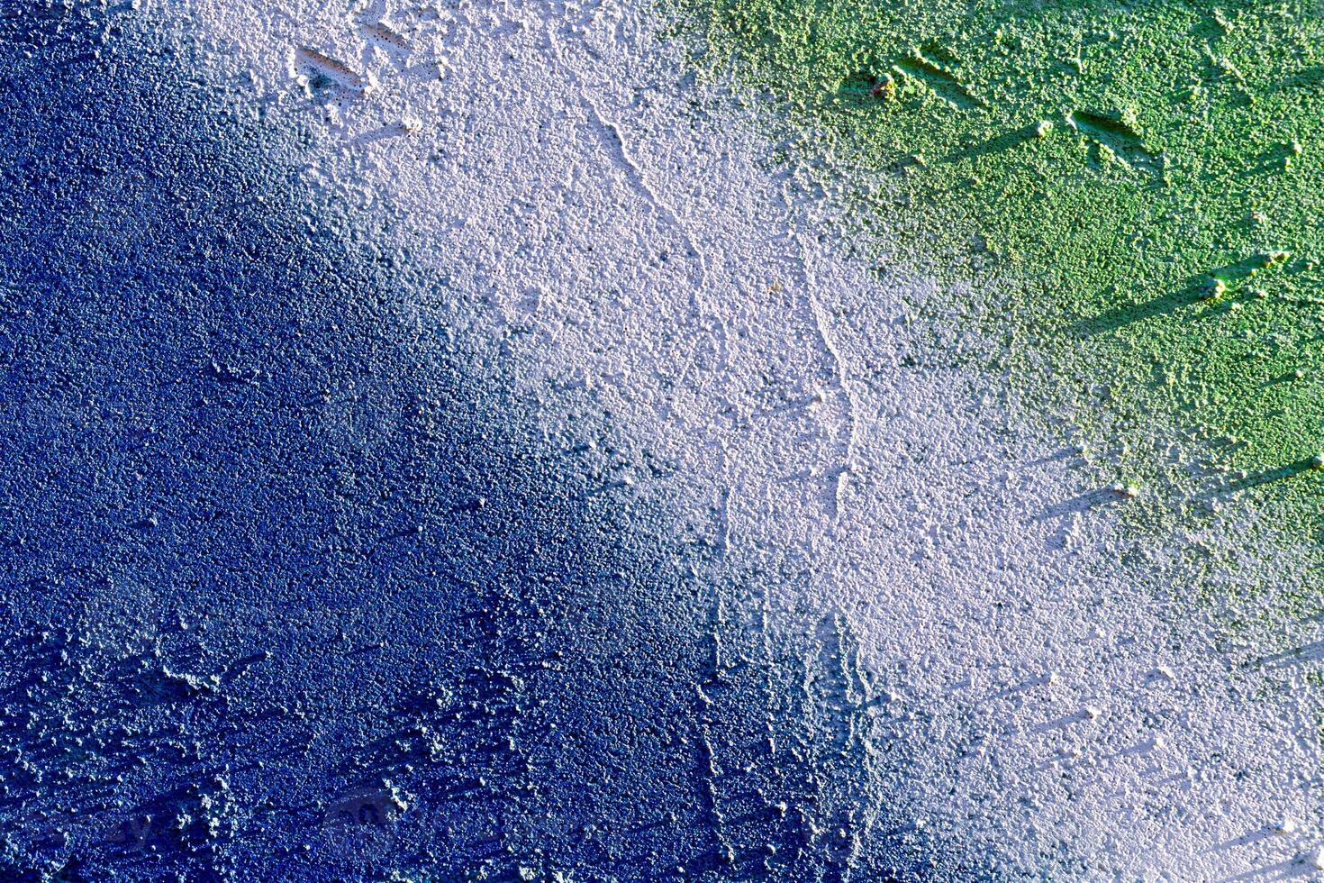 Fragment of colored graffiti painted on a wall. Abstract backdrop for design. photo