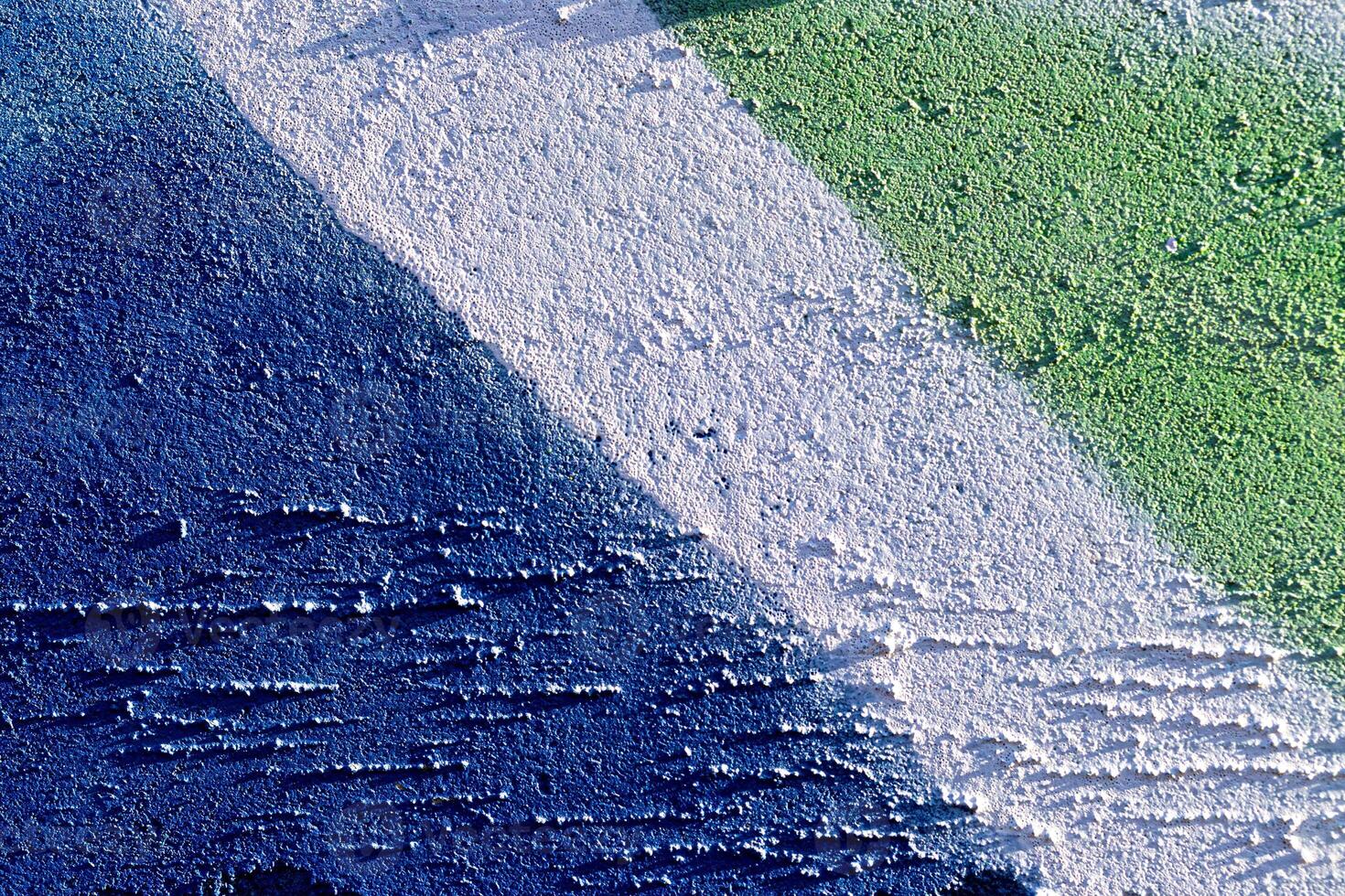 Fragment of colored graffiti painted on a wall. Abstract background for design. photo