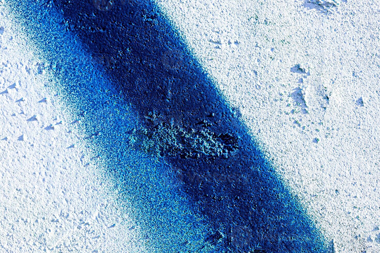 Fragment of colored graffiti painted on a wall. Abstract background for design. photo