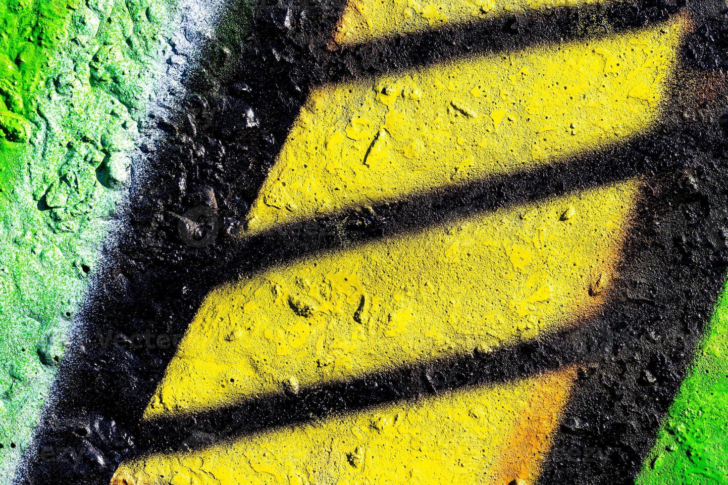 Fragment of colored graffiti painted on a concrete wall. Abstract background for design. photo