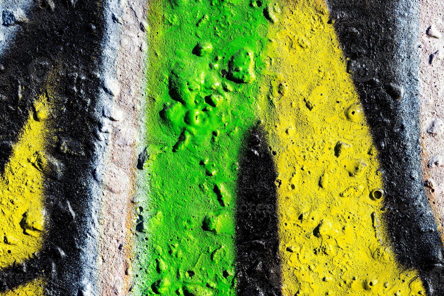 Fragment of colored graffiti painted on a concrete wall. Abstract background for design. photo