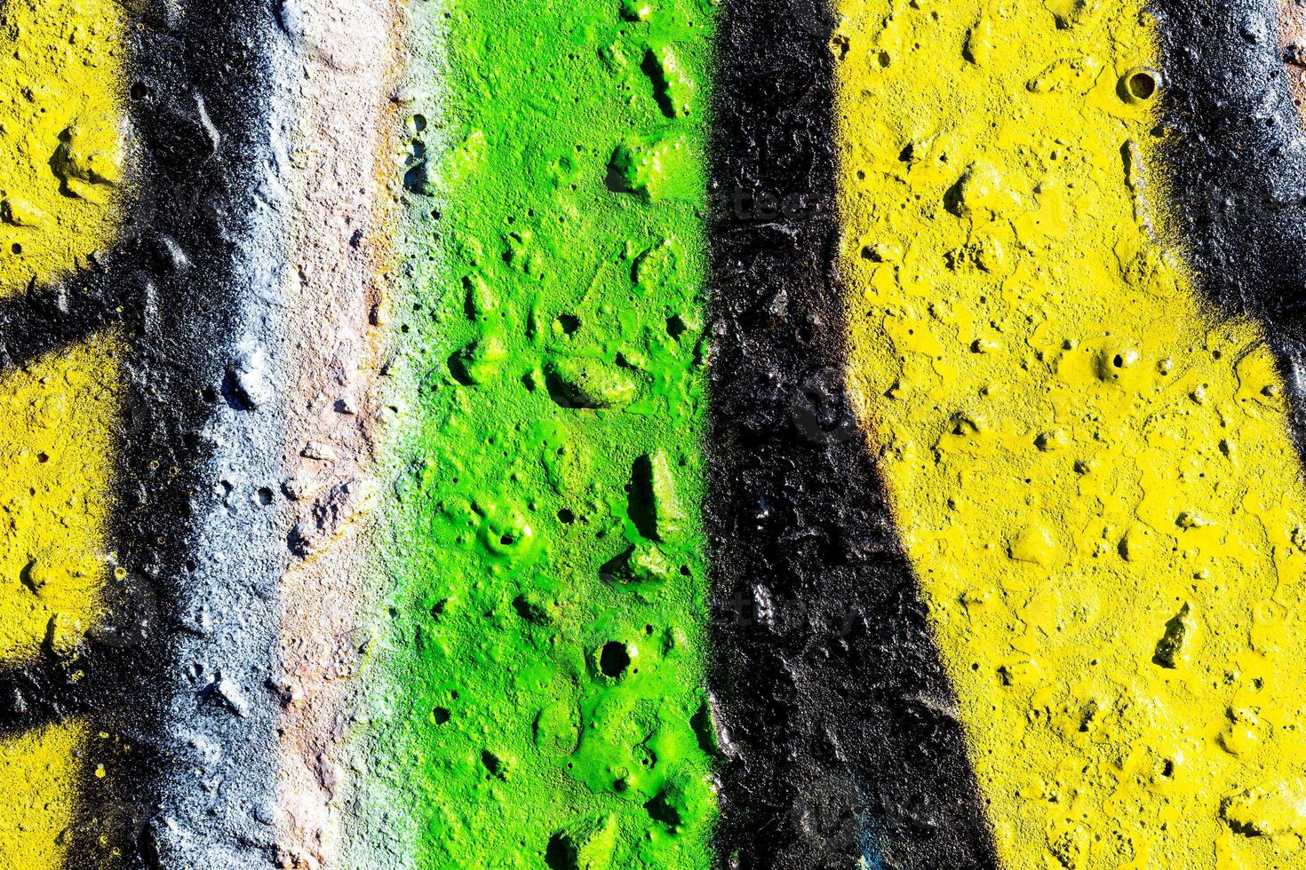 Fragment of colored graffiti painted on a concrete wall. Abstract background for design. photo