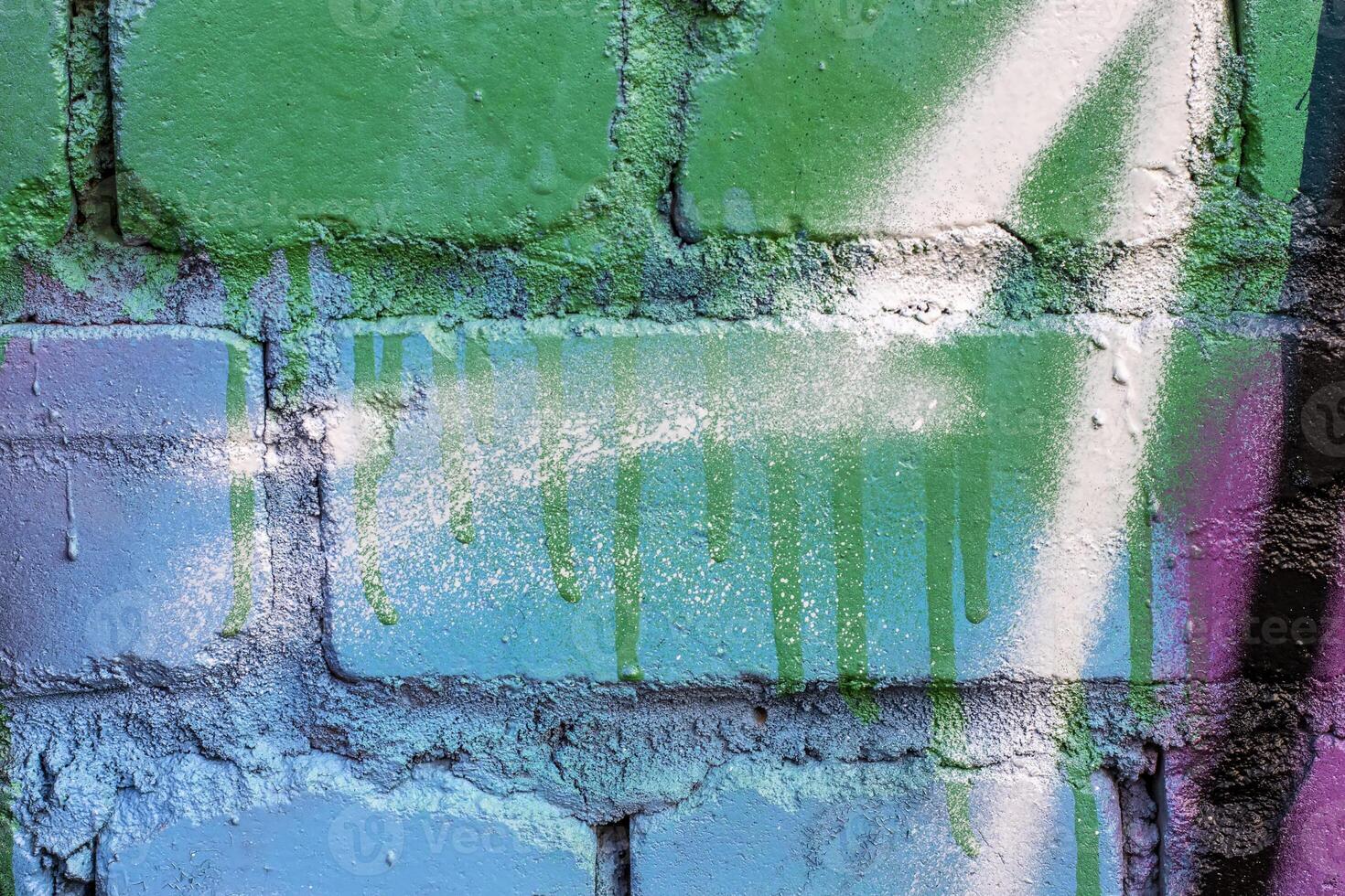 Graffiti painted on a brick wall texture. photo