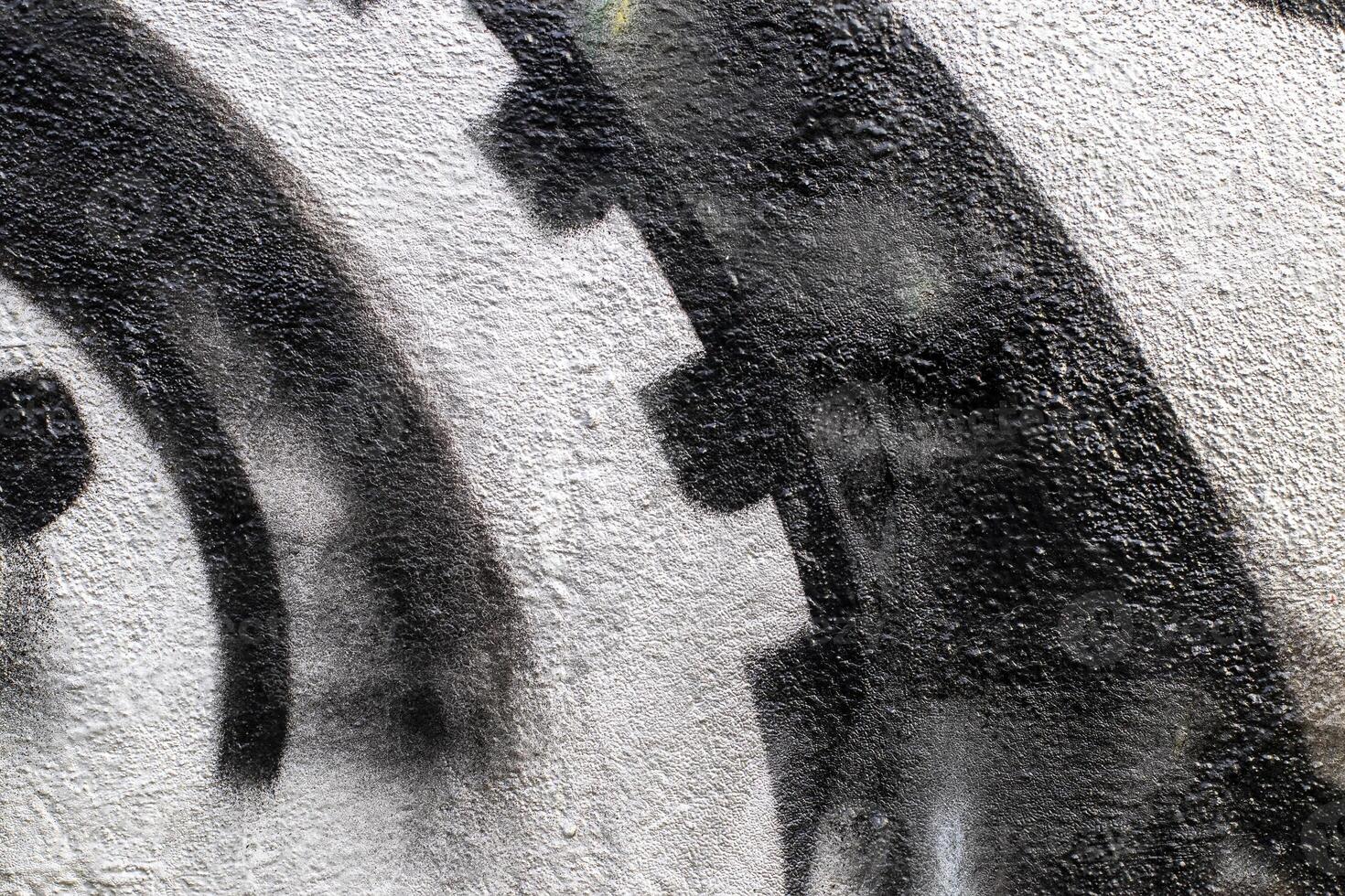 Graffiti painted on a concrete wall texture. photo