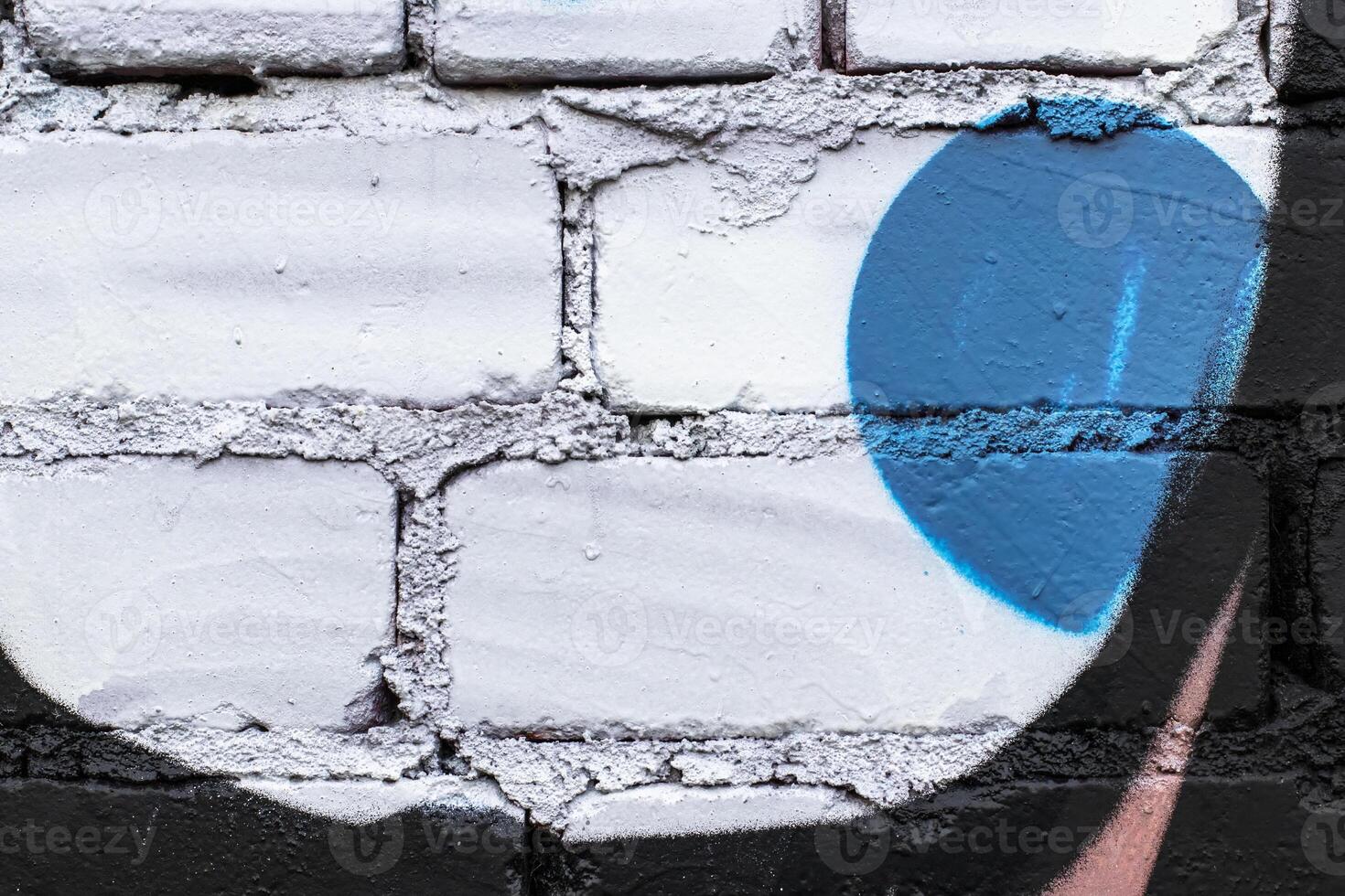 Graffiti painted on a brick wall texture. photo